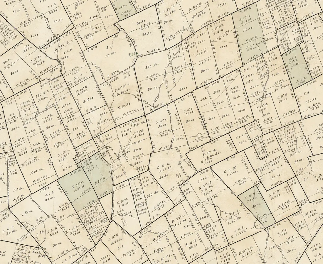 A detail of an antique Leon County, Texas plat map: surveyed tracts labeled with abstract numbers, acreages, and bearings, with creeks running through them